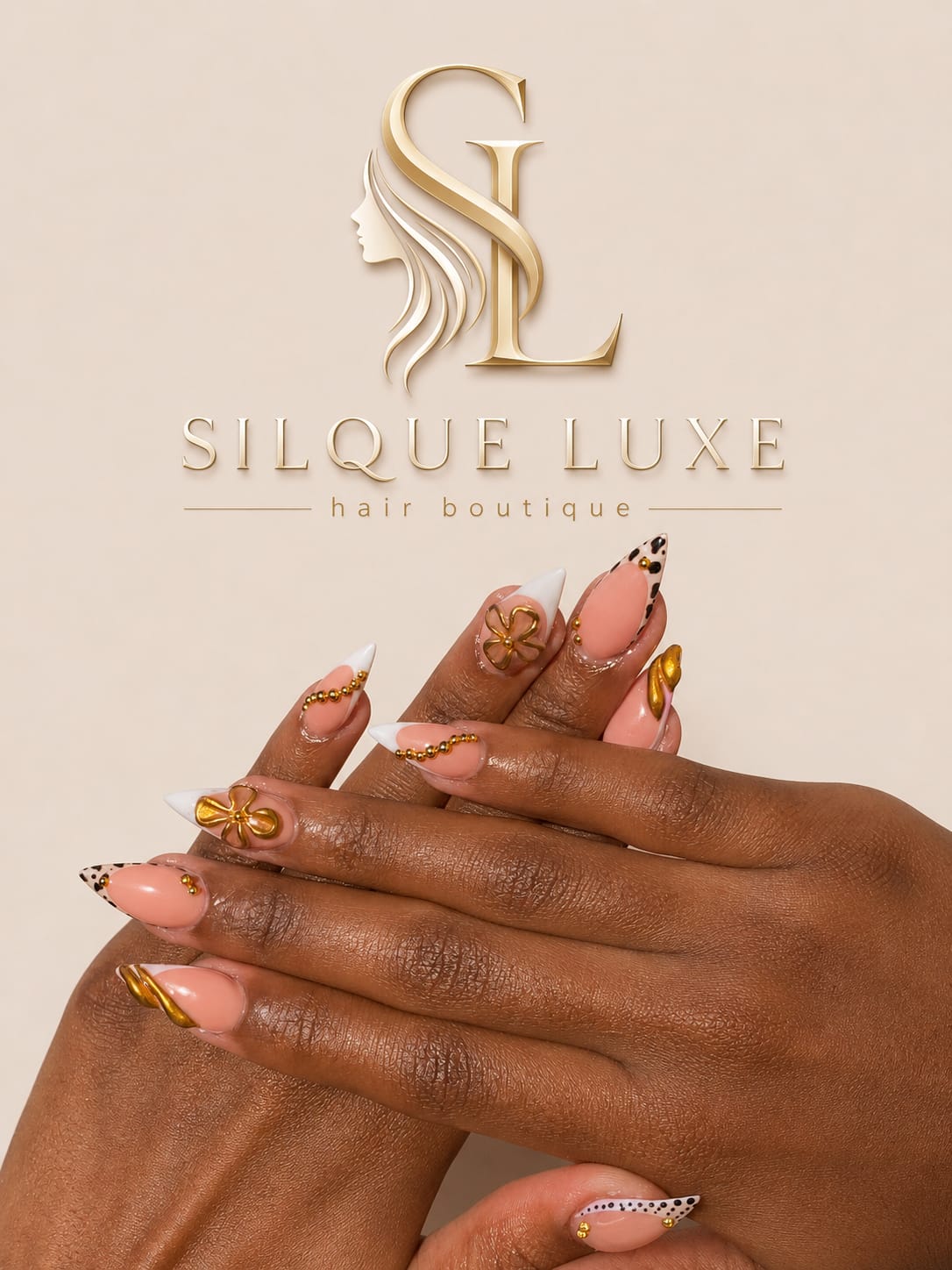 Gold nail art with the Silque Luxe emblem